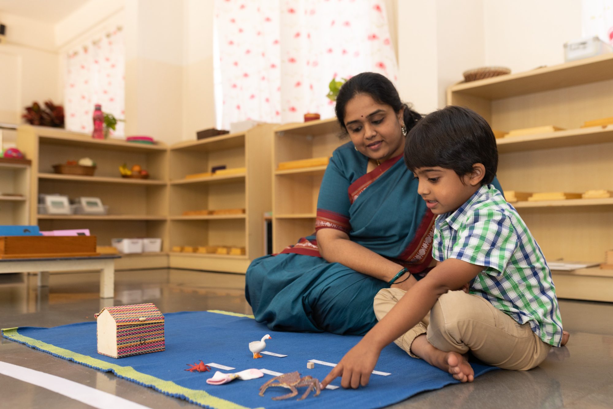 A teacher giving a lesson to a child